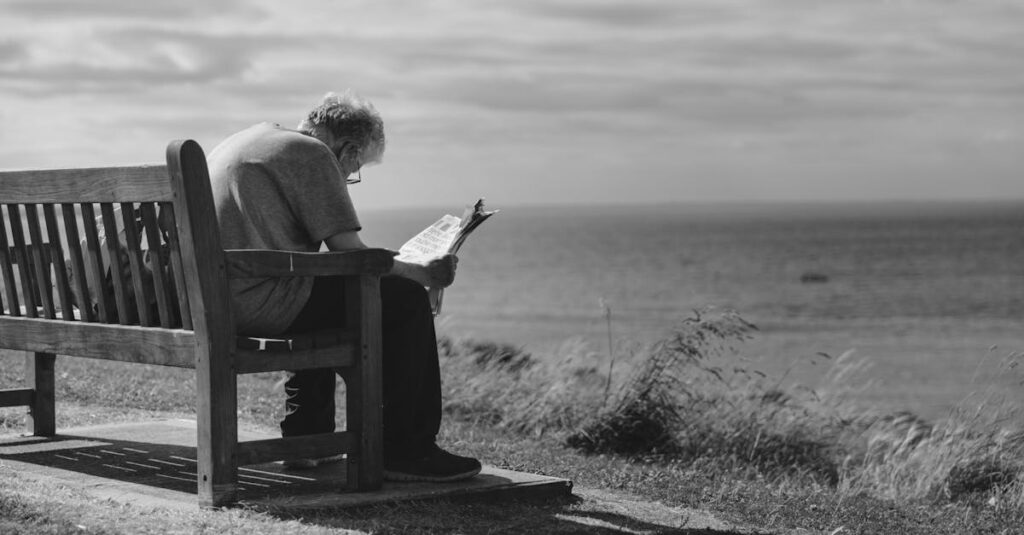 A contemplative scene of an elderly man reading a newspaper on a seaside bench with cloudy skies.